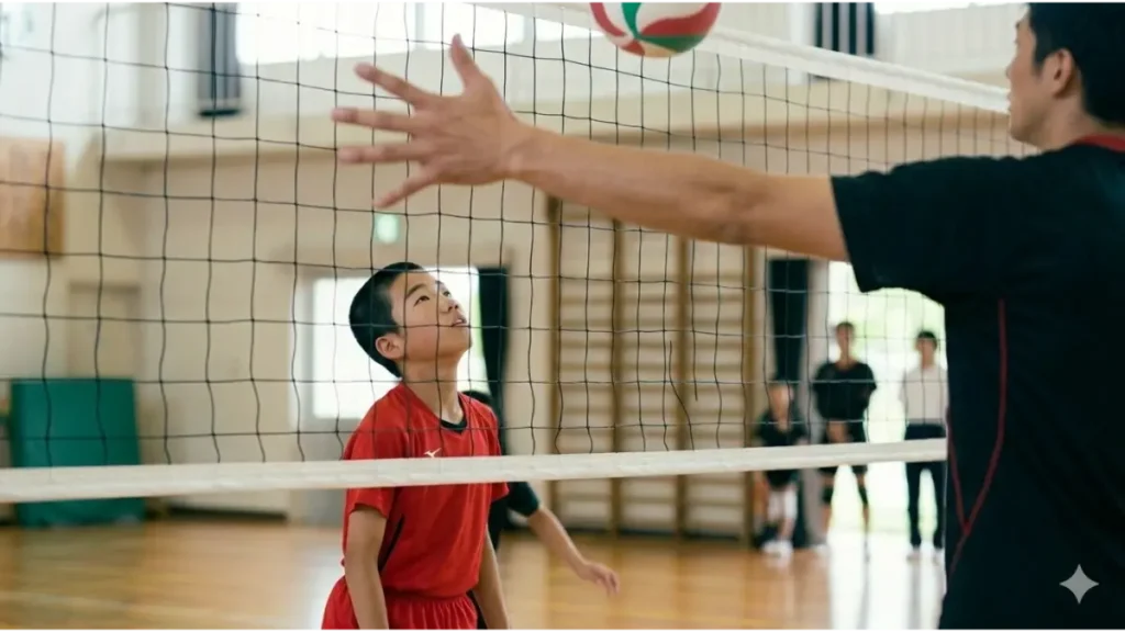 体育館で高身長選手の見上げる小柄な中学生バレーボール選手