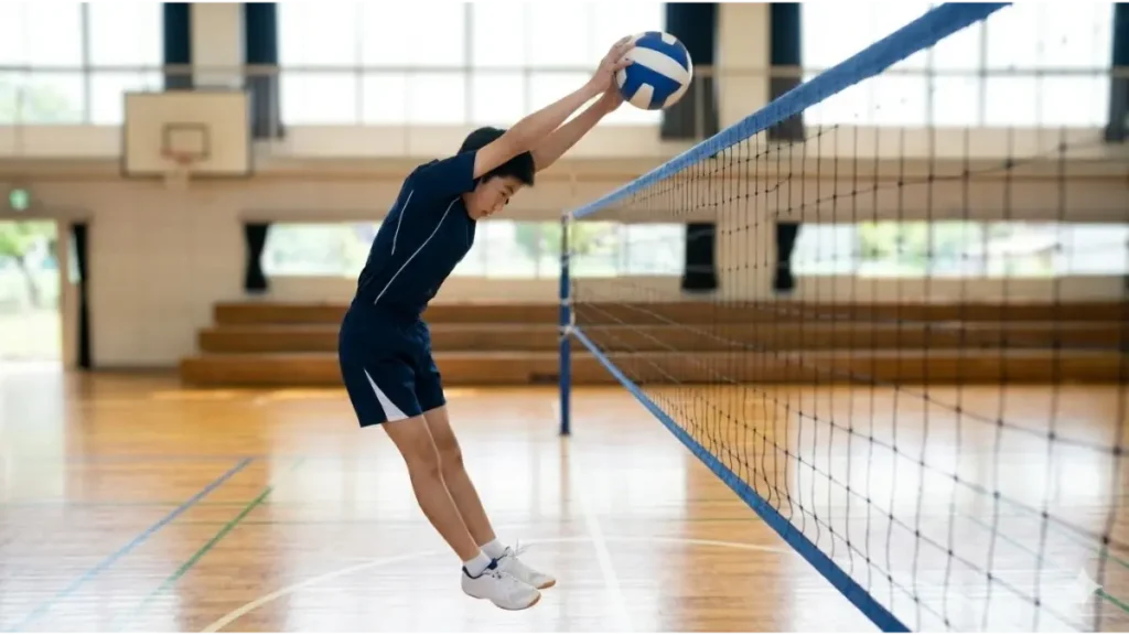 バレーボールのブロックでタッチネットを避けるための空中の正しい姿勢（くの字姿勢）の横からの視点